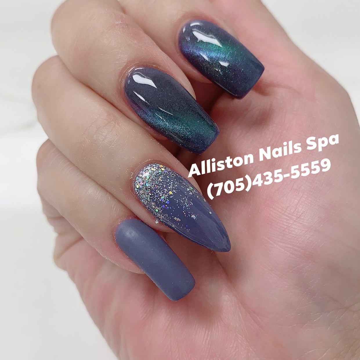 Iridescent dark teal nails with glitter